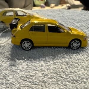 NWT ERTL 2002 Mitsubishi Lancer Evolution set of 2